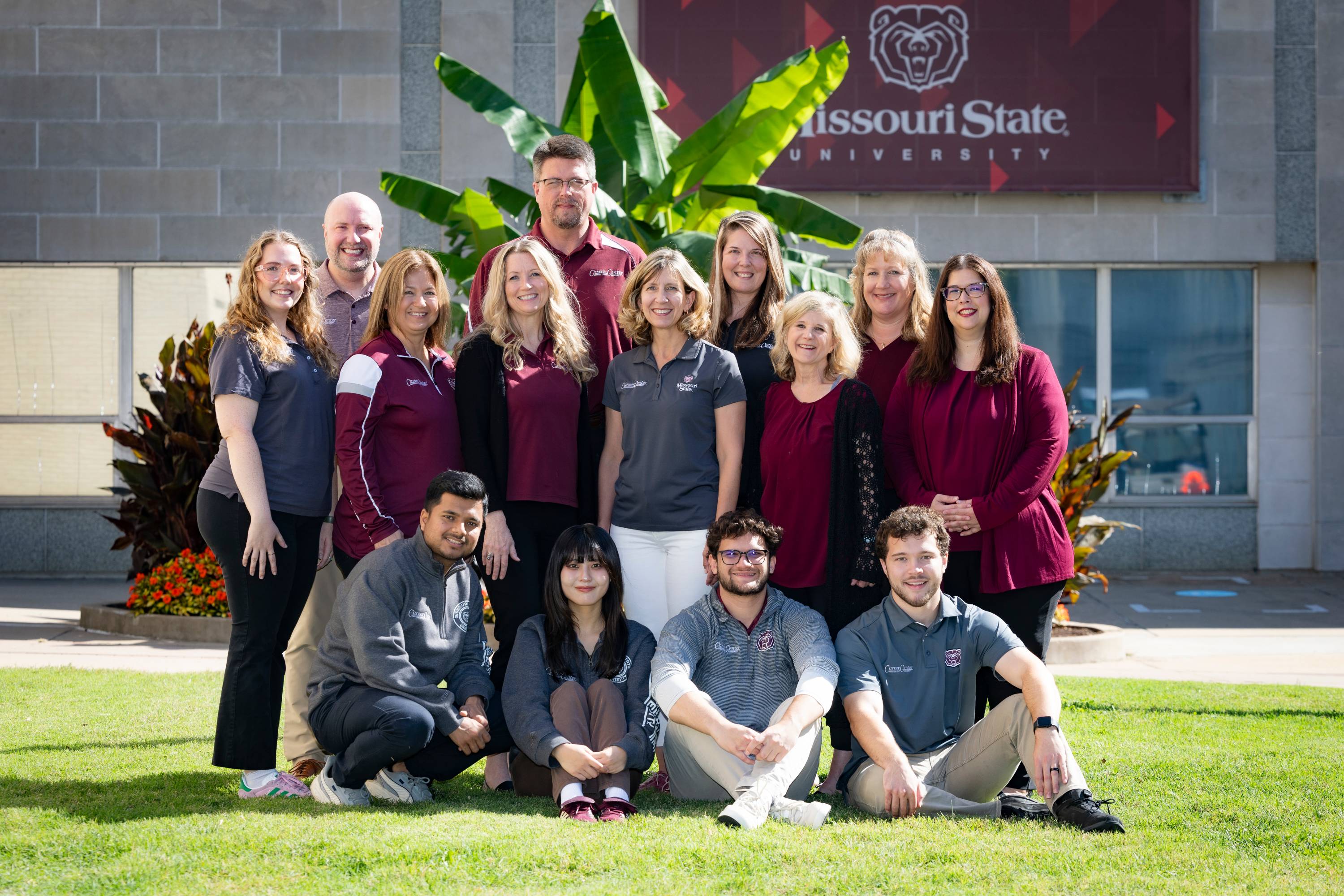 The Career Center staff poses for a photo on a beautiful autumn day on campus